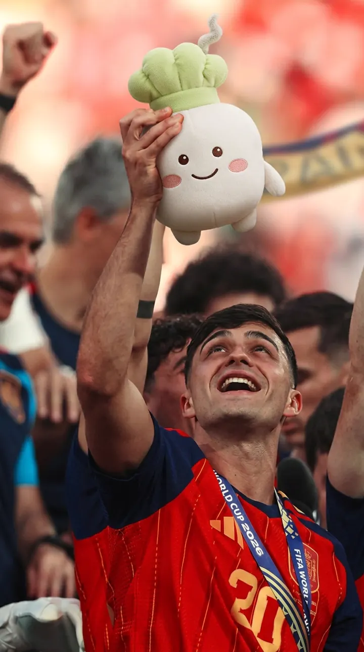 A football champion lifting Pip above the crowd